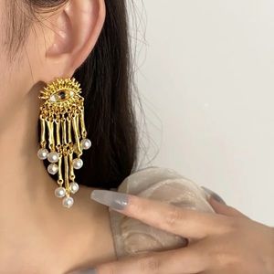 Schiaparelli style earrings